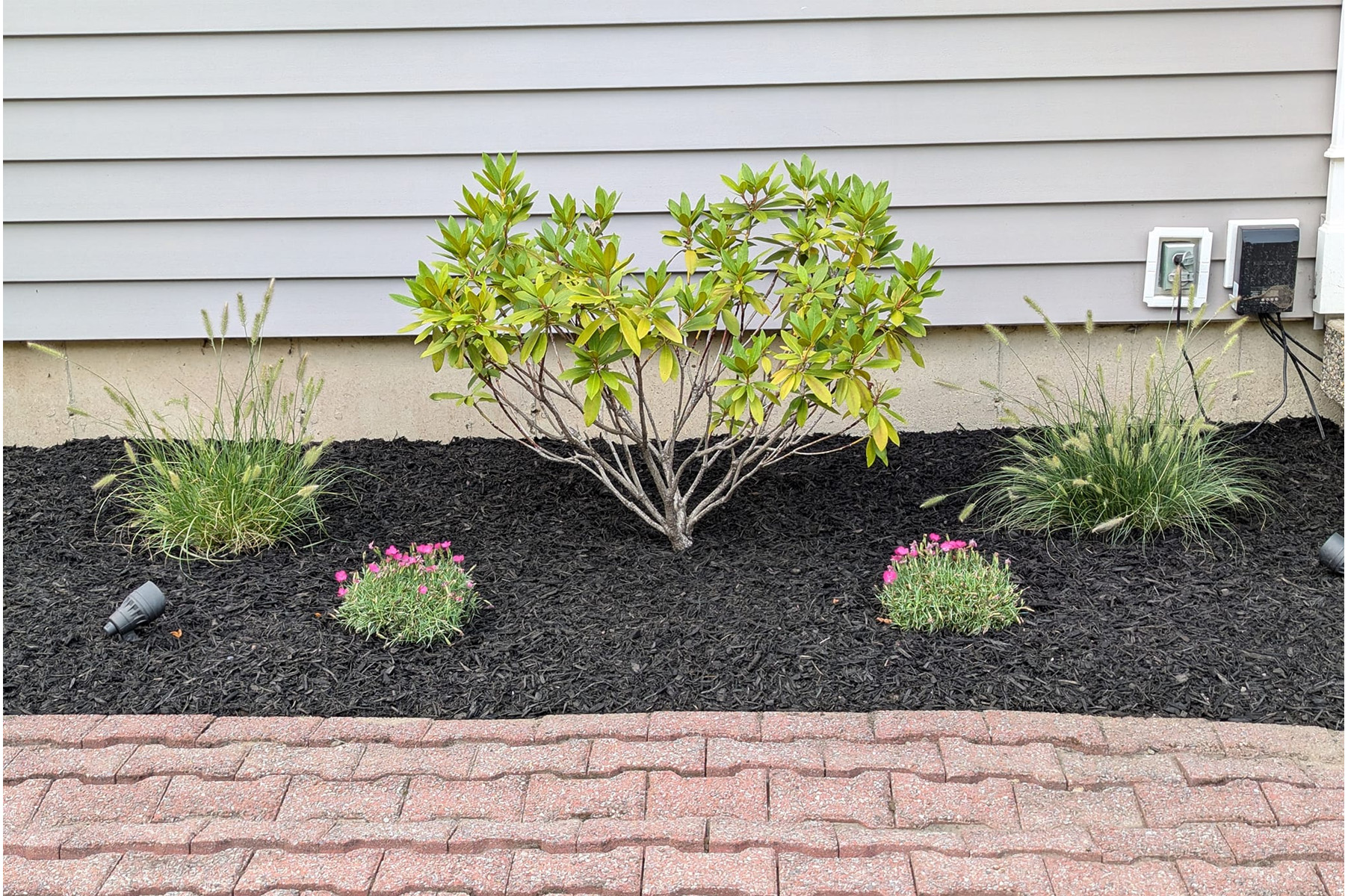 Thumbnail of installation of stone sidewalk in front of house