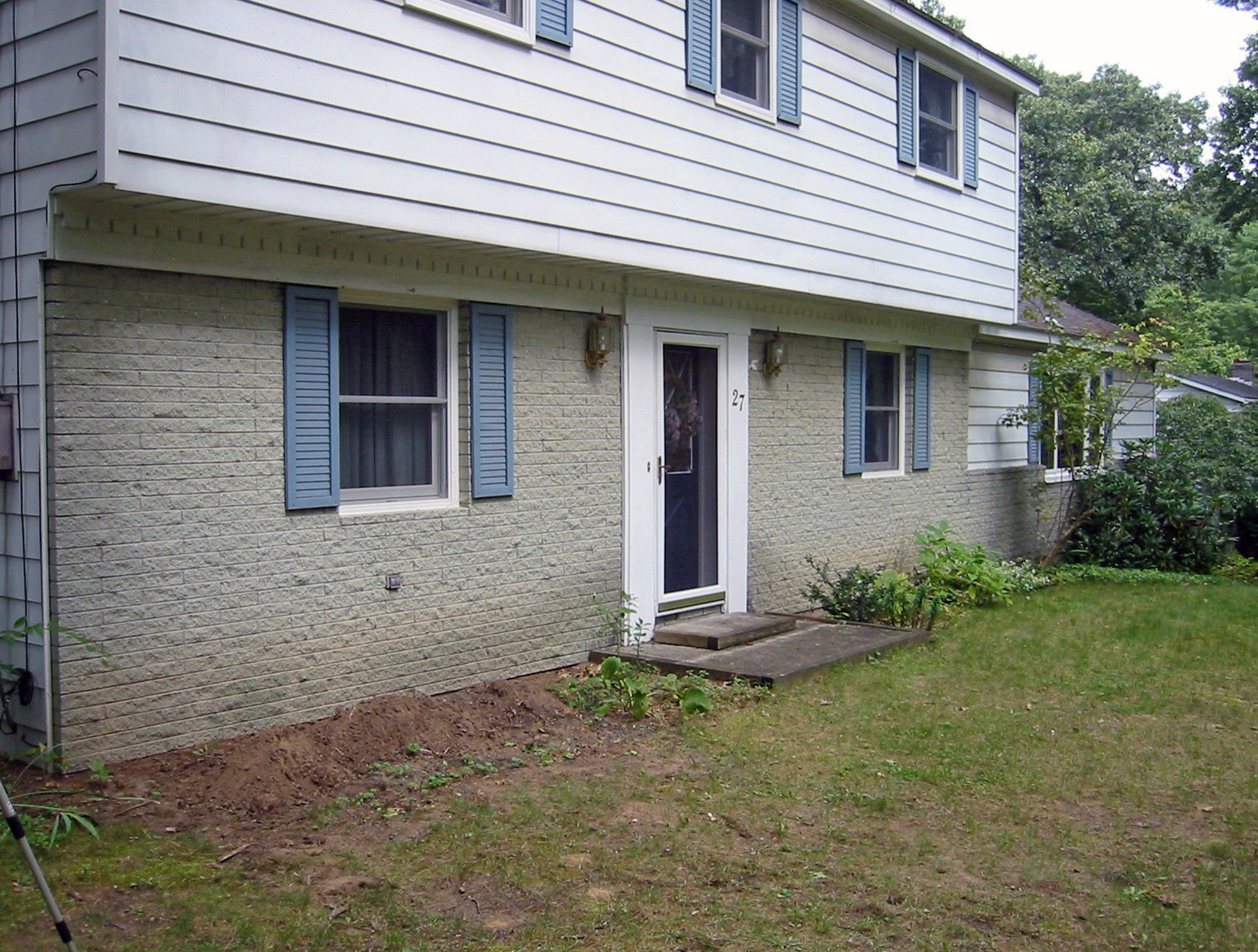 Before image of front yard with no landscaping