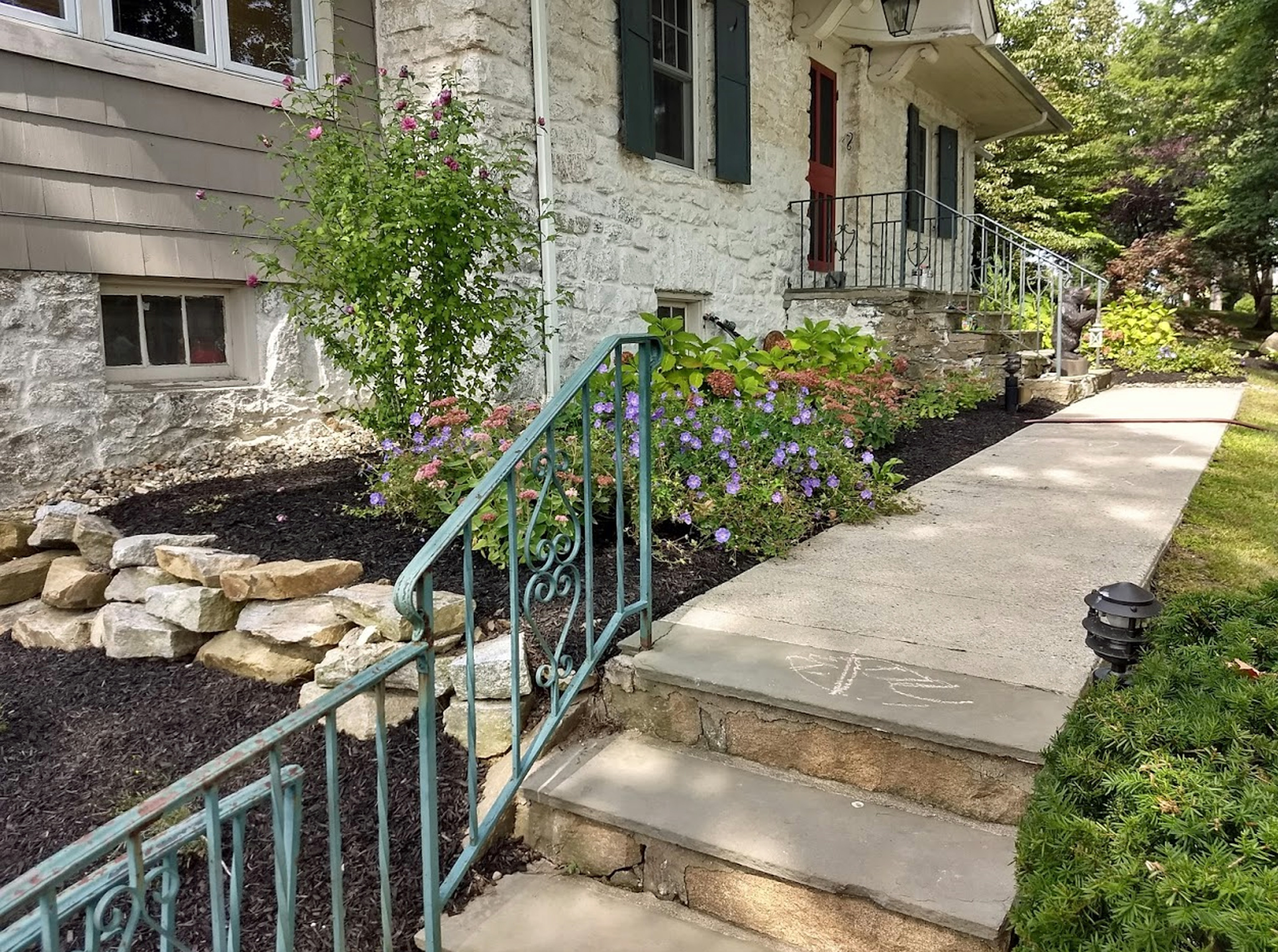 Thumbnail of completed plant bed, along the walkway, with mulch, and stone