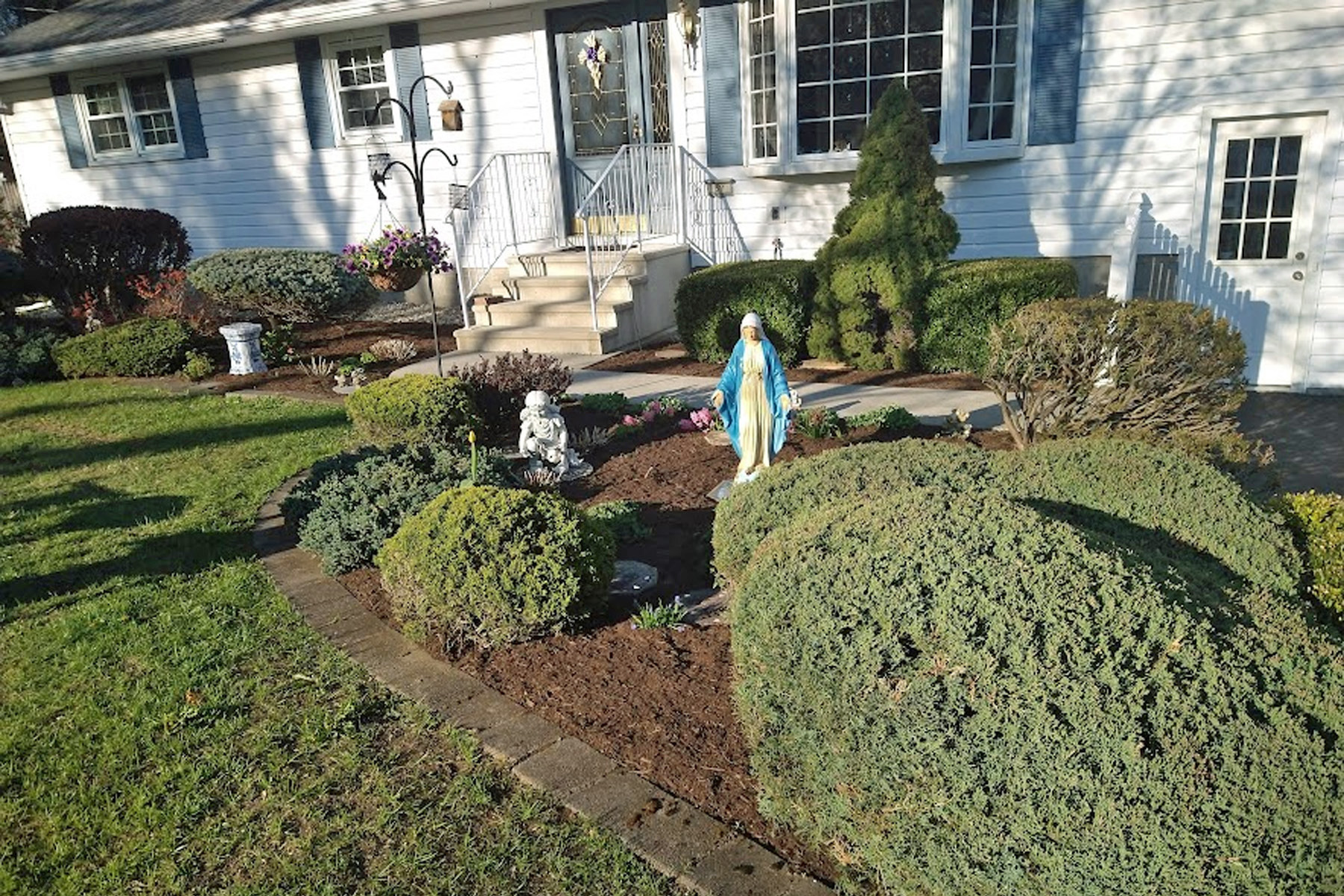 Thumbnail of completed trimming, bed cleanup, and fresh mulch