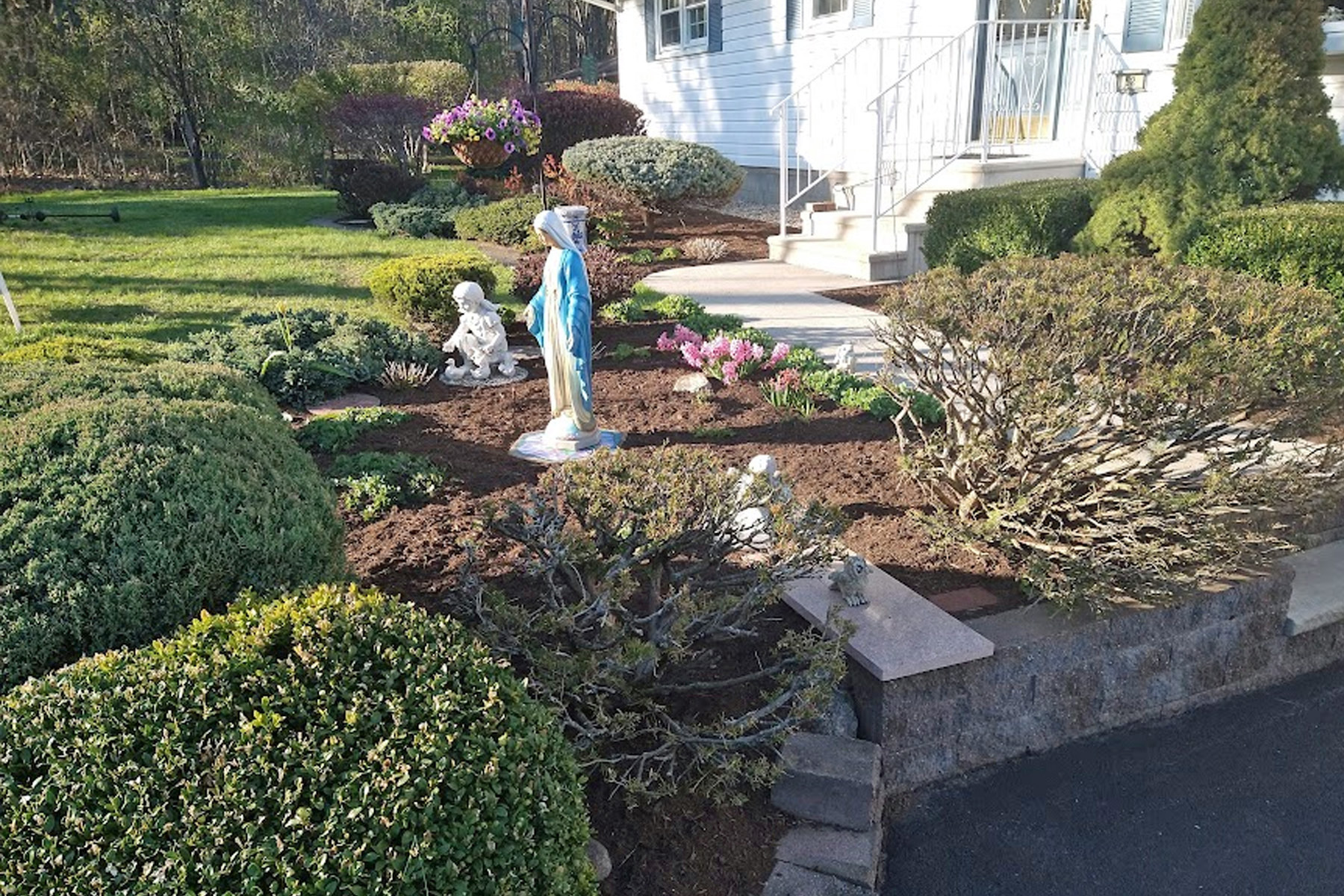 Thumbnail of completed trimming, bed cleanup, and fresh mulch